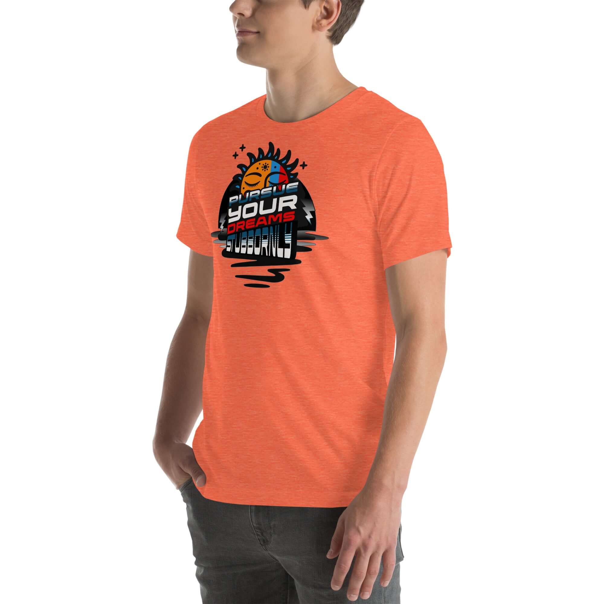 Orange t-shirt with 'Pursue Your Dreams Stubbornly' and cosmic design, worn by a model, from Cosmic Motivation Apparel.