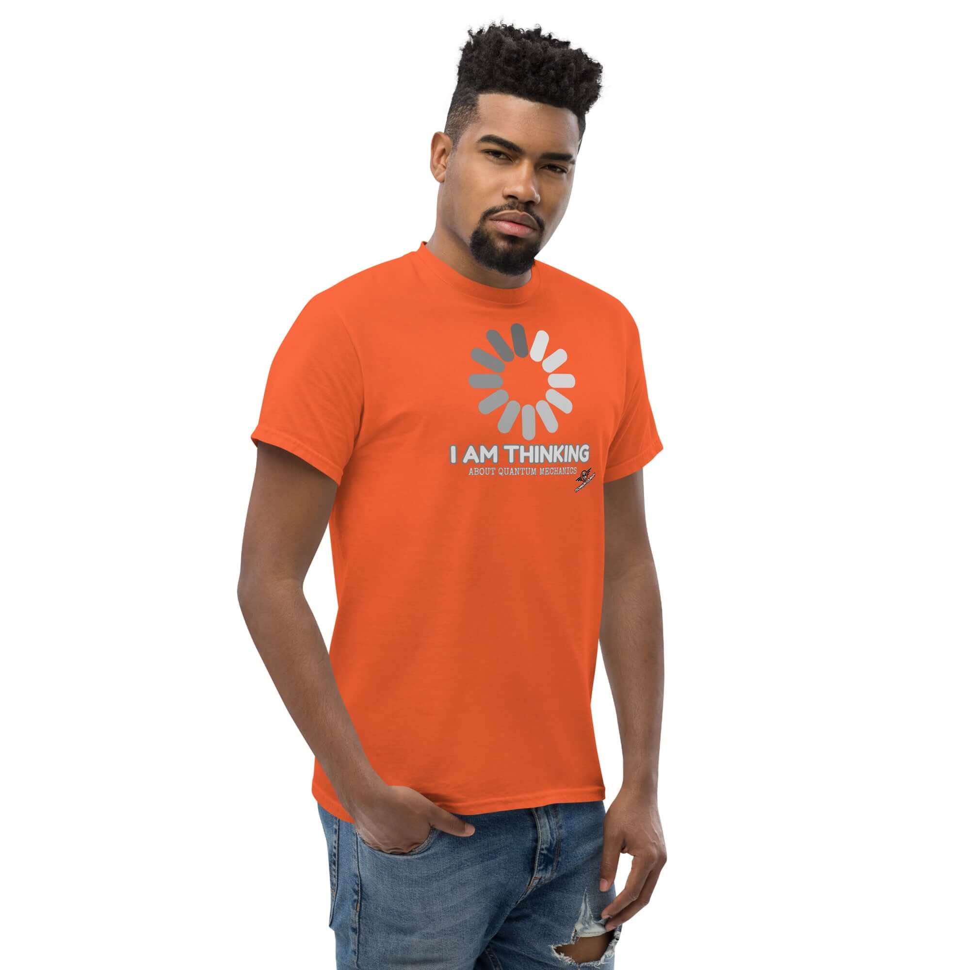 Person wearing orange Quantum Mechanics Loading Screen T-Shirt with Schrödinger's Buffer design.