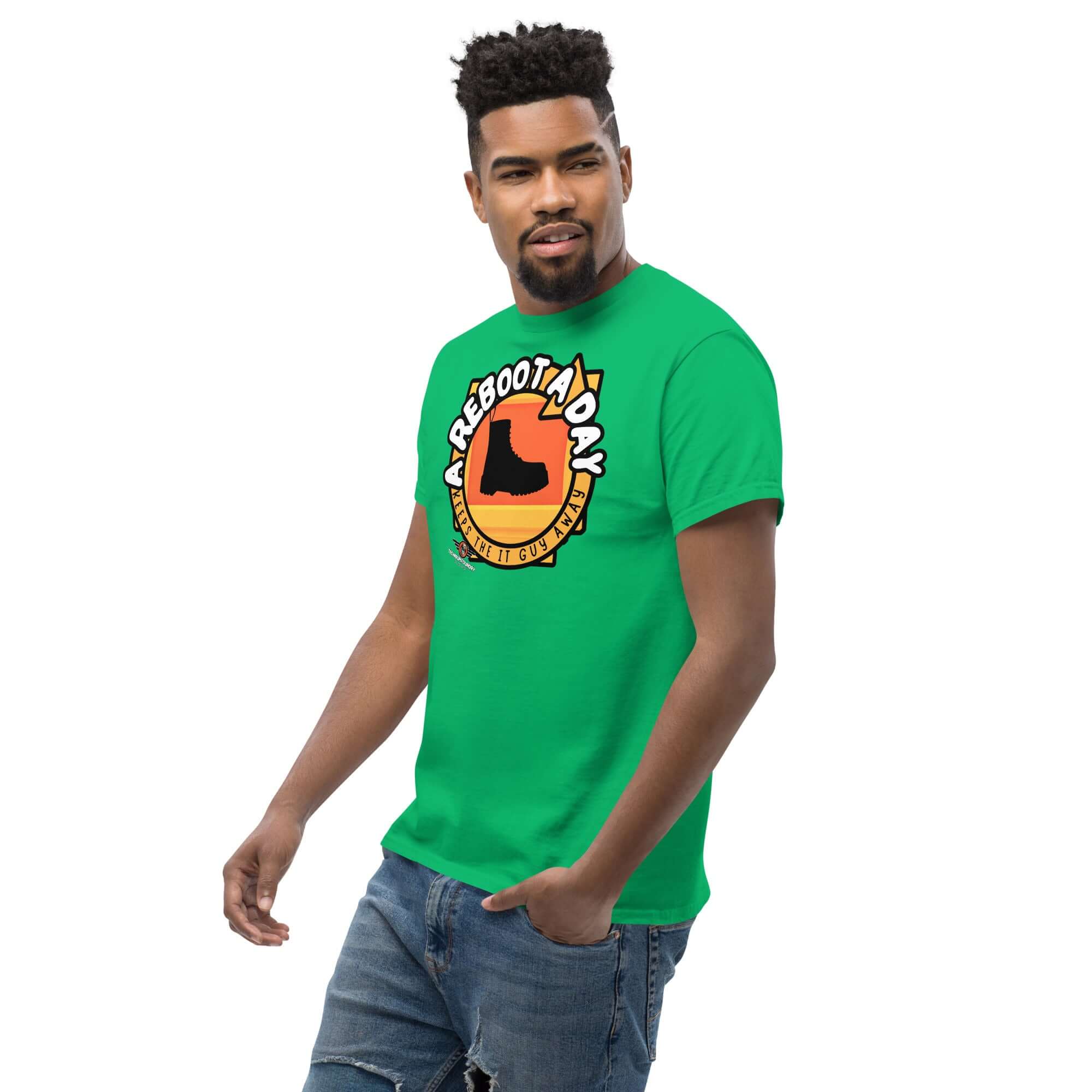 Green "A Reboot A Day" IT support humor t-shirt featuring a combat boot design with sunset backdrop, modeled by a person.