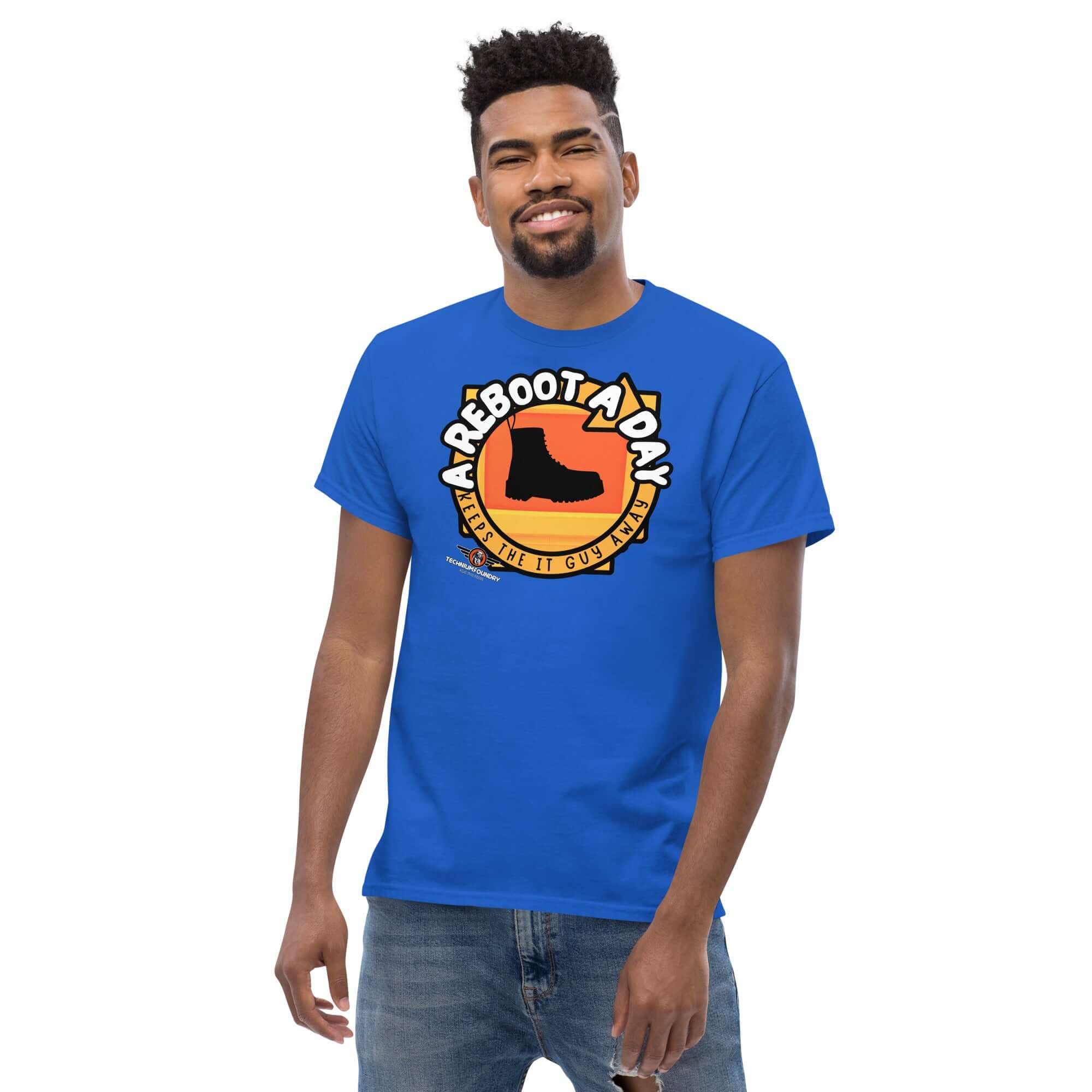 A man wearing a blue "A Reboot A Day" IT support humor t-shirt with tech help desk boot design.