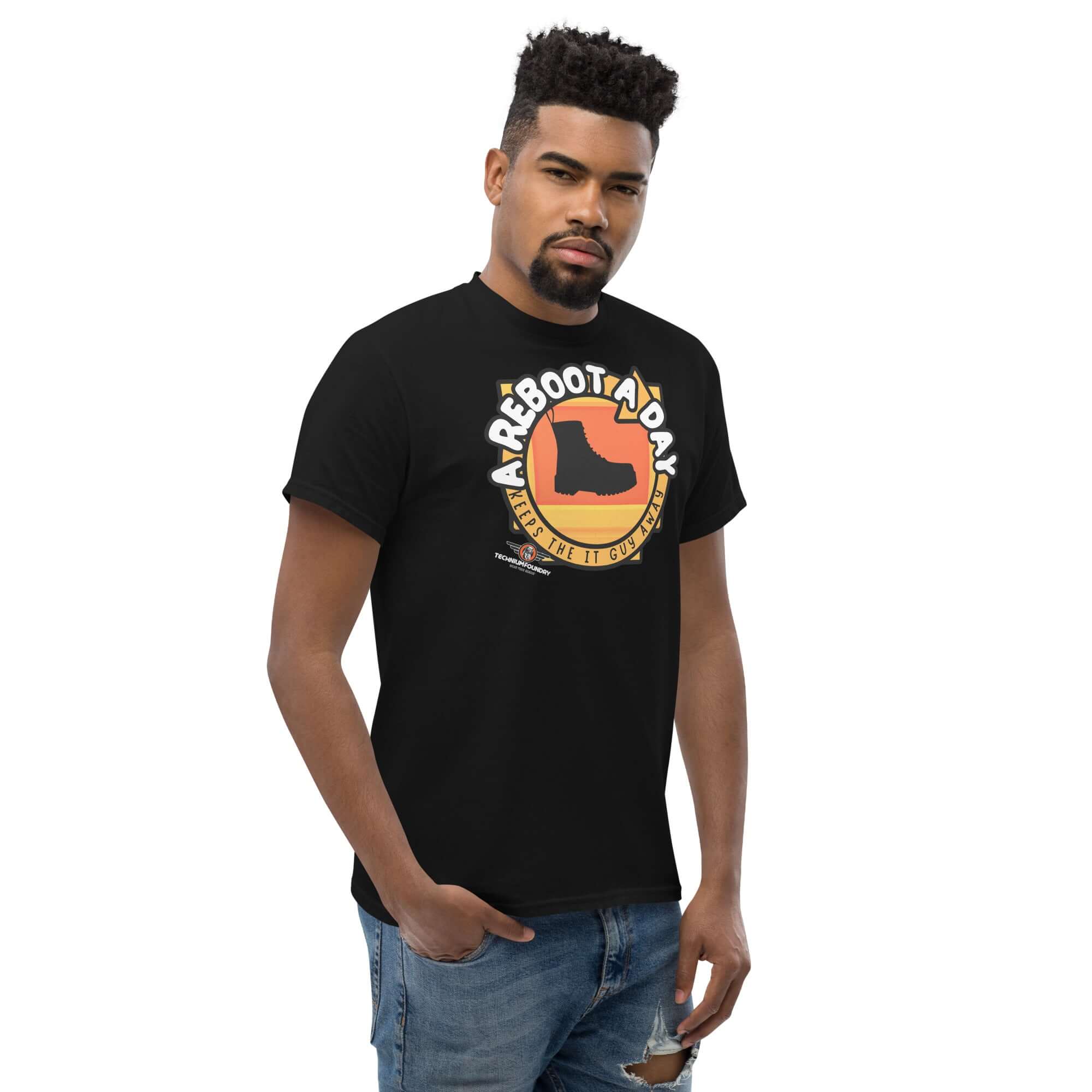 Man wearing 'A Reboot A Day' IT support humor t-shirt with tech help desk boot design.
