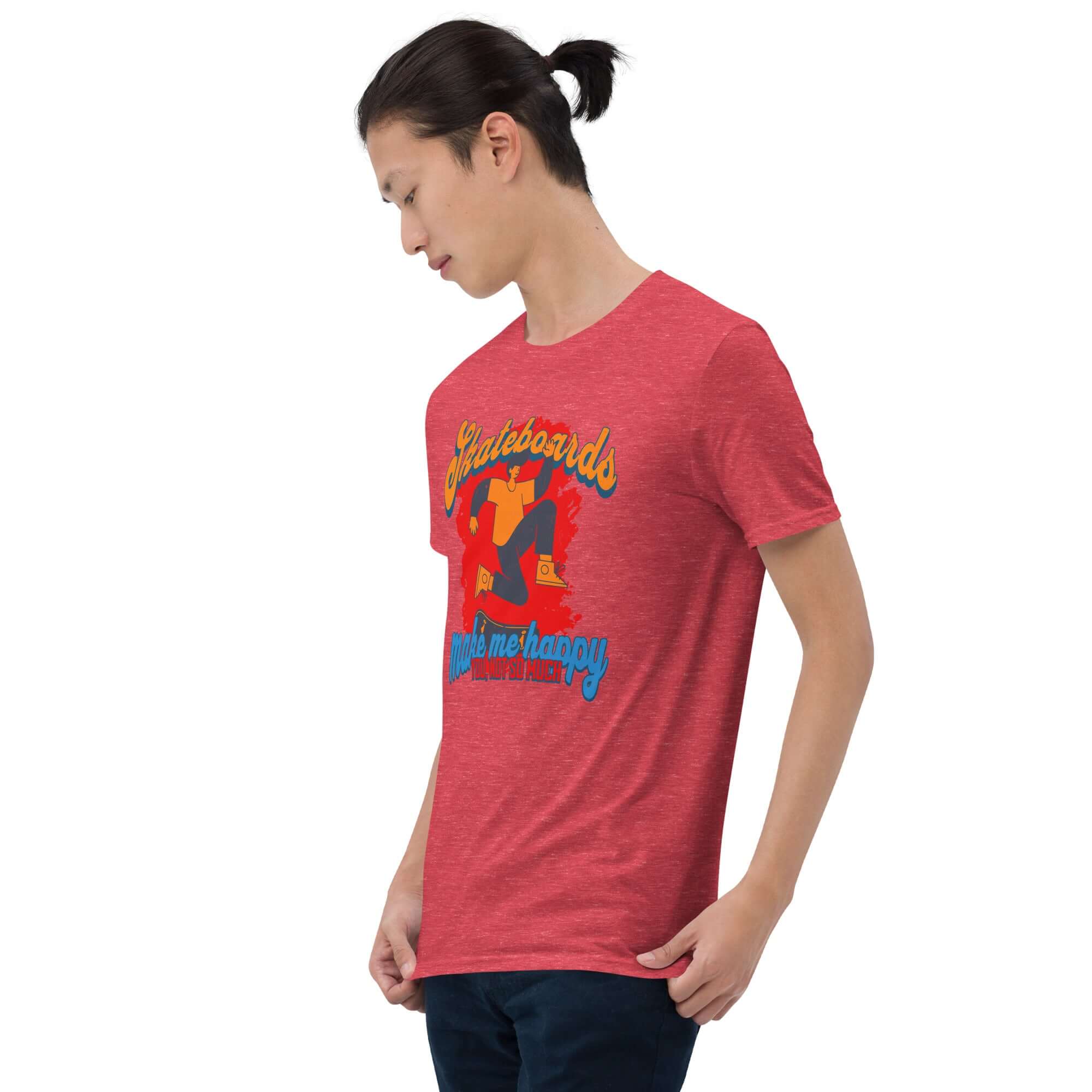 Person wearing a red t-shirt with 'Skateboards Make Me Happy You Not So Much' humorous skateboard graphic.