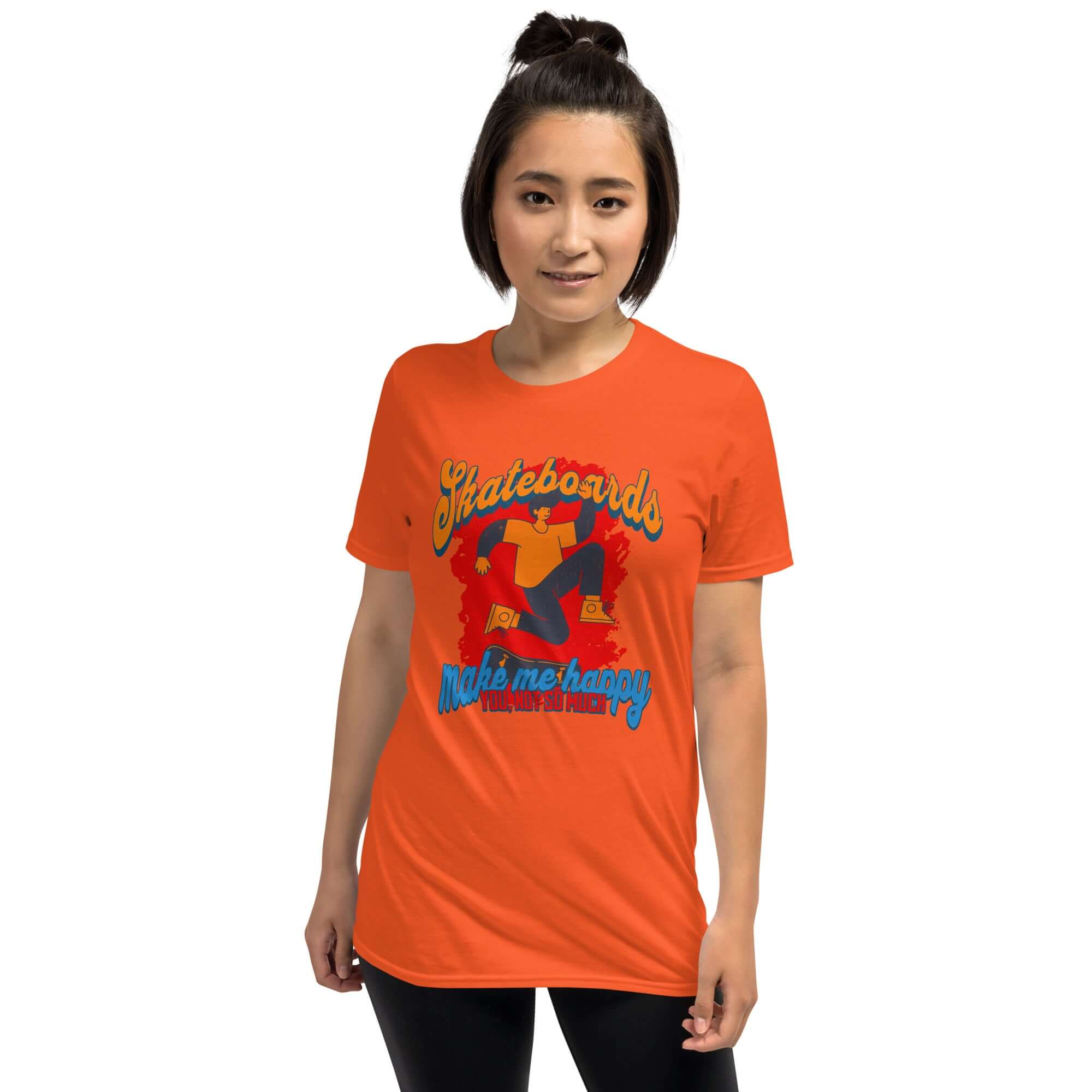 Woman wearing orange "Skateboards Make Me Happy You Not So Much" T-shirt featuring skateboard humor design.