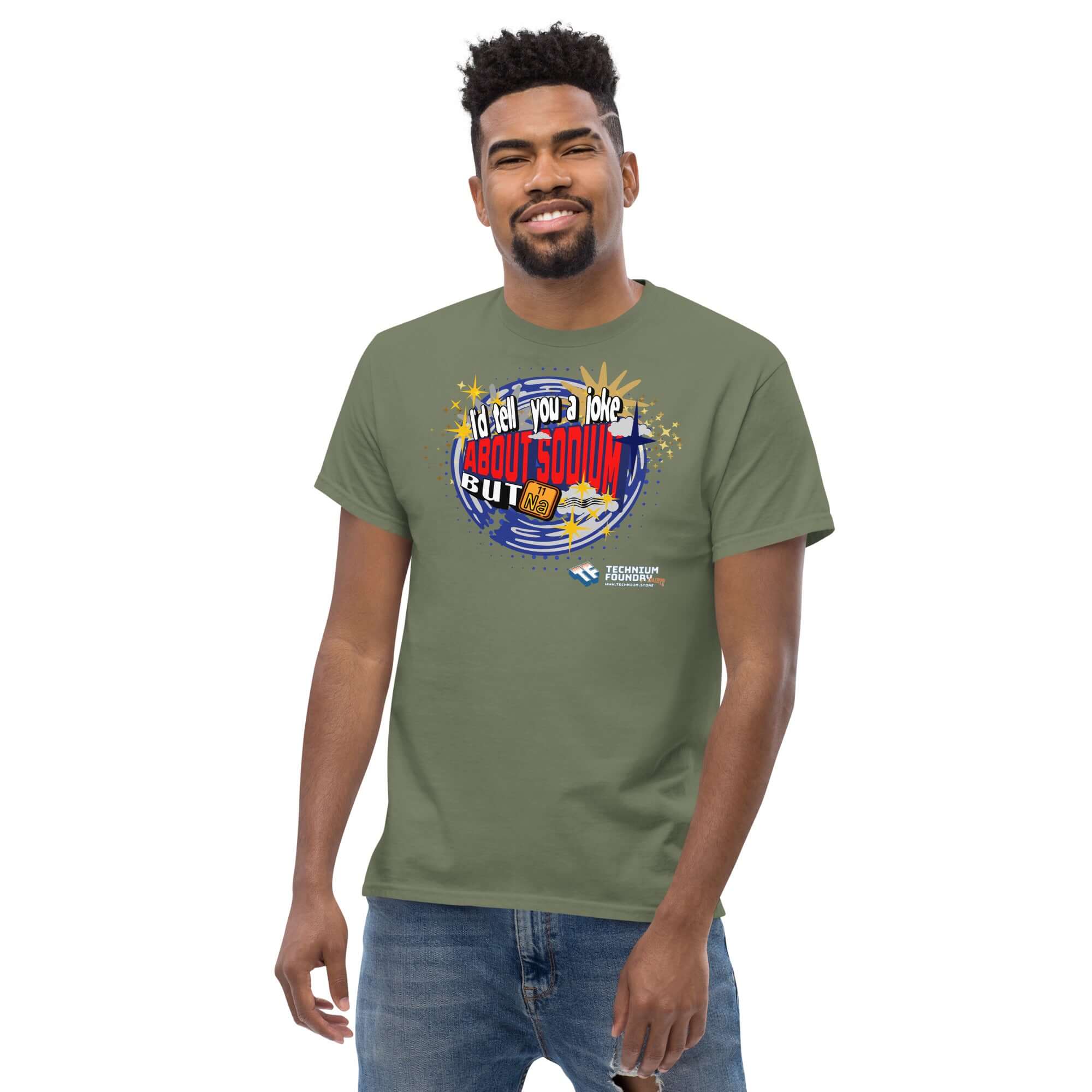 Man wearing a Sodium Chemistree Joke T-Shirt with periodic table humor, cosmic blue swirl design, and chemistry pun slogan.