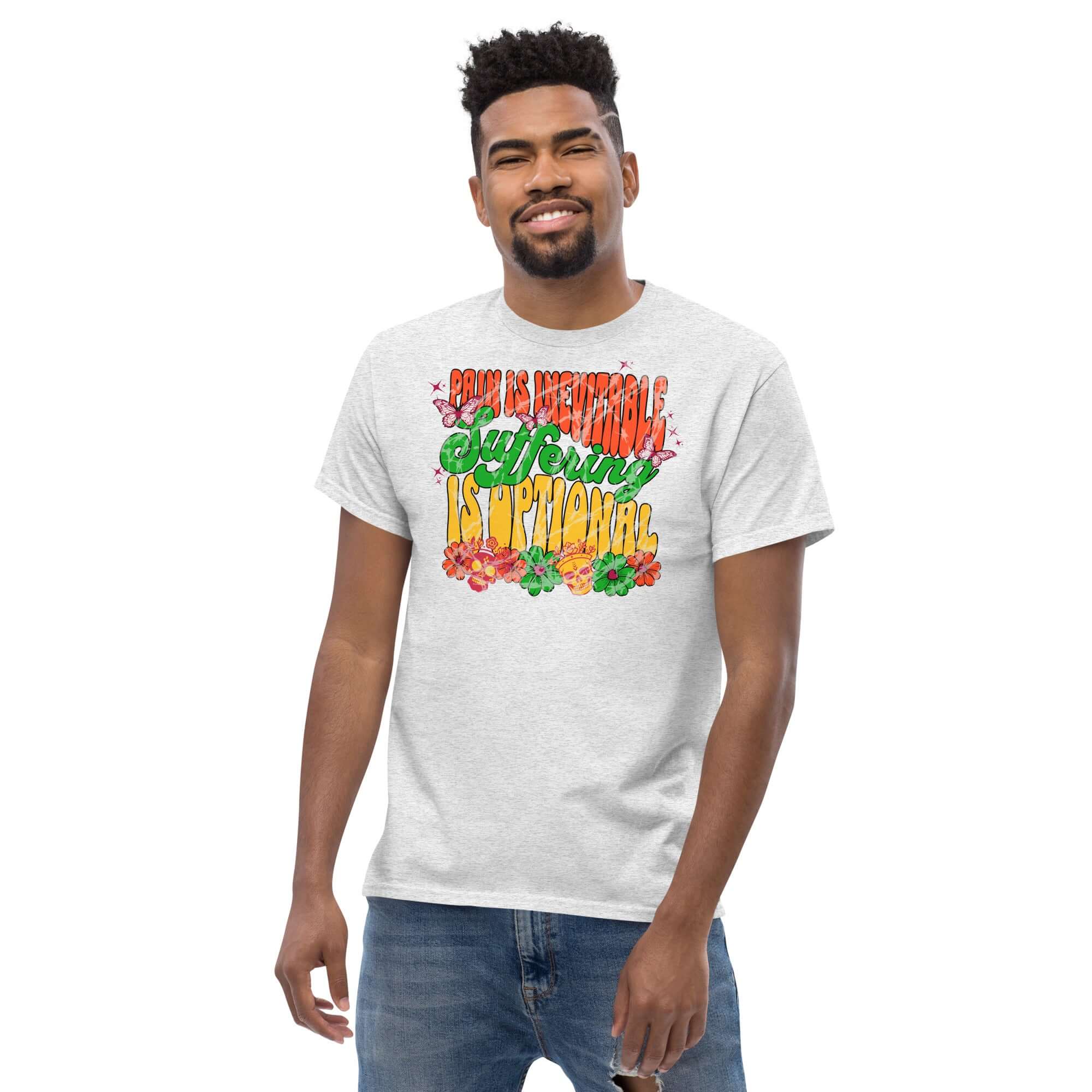 Model wearing 'Pain is Inevitable, Suffering is Optional' psychedelic Stoic philosophy t-shirt with graffiti-style design.