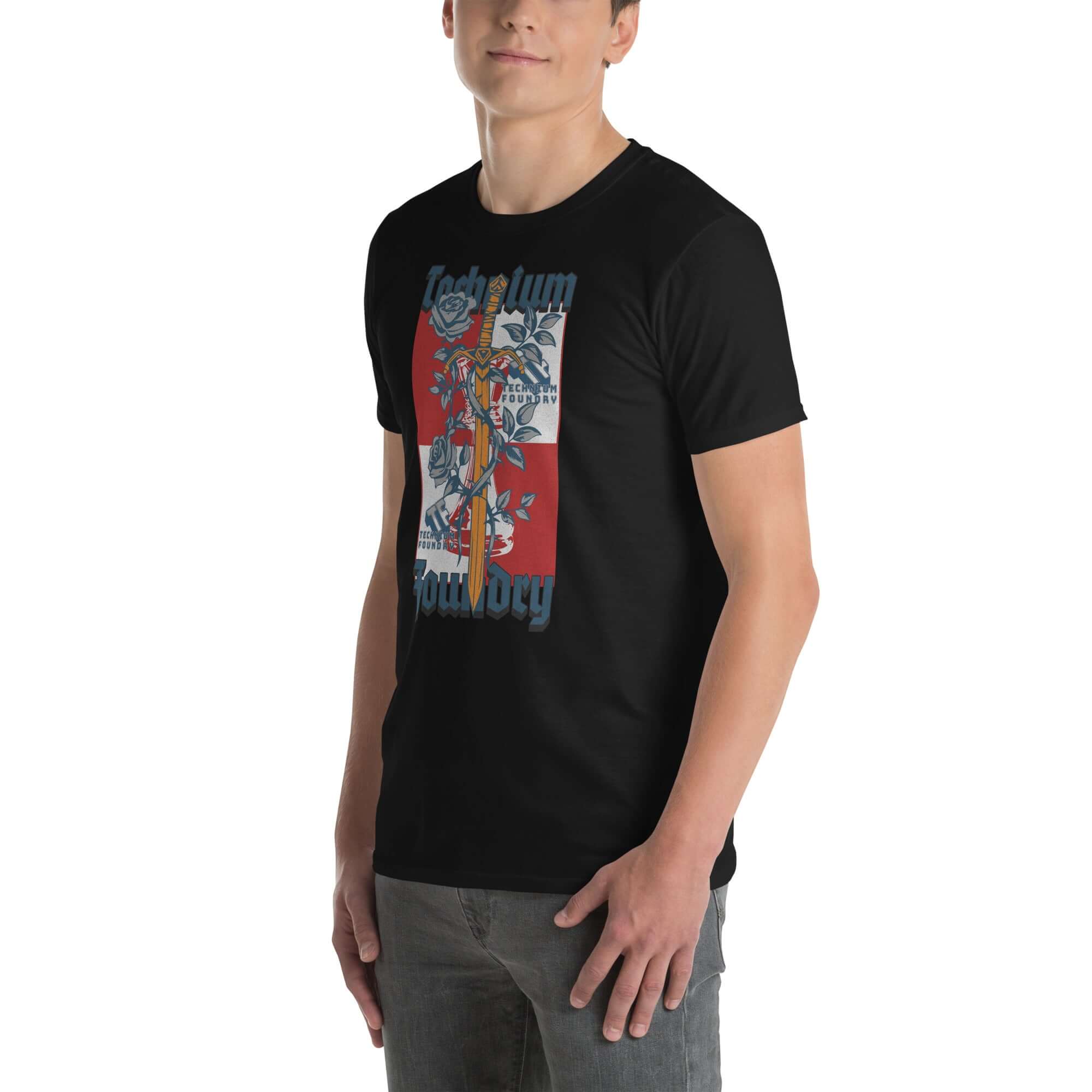 Person wearing a black Technium Foundry Logo T-Shirt, featuring a vibrant orange and blue intellectual emblem design.