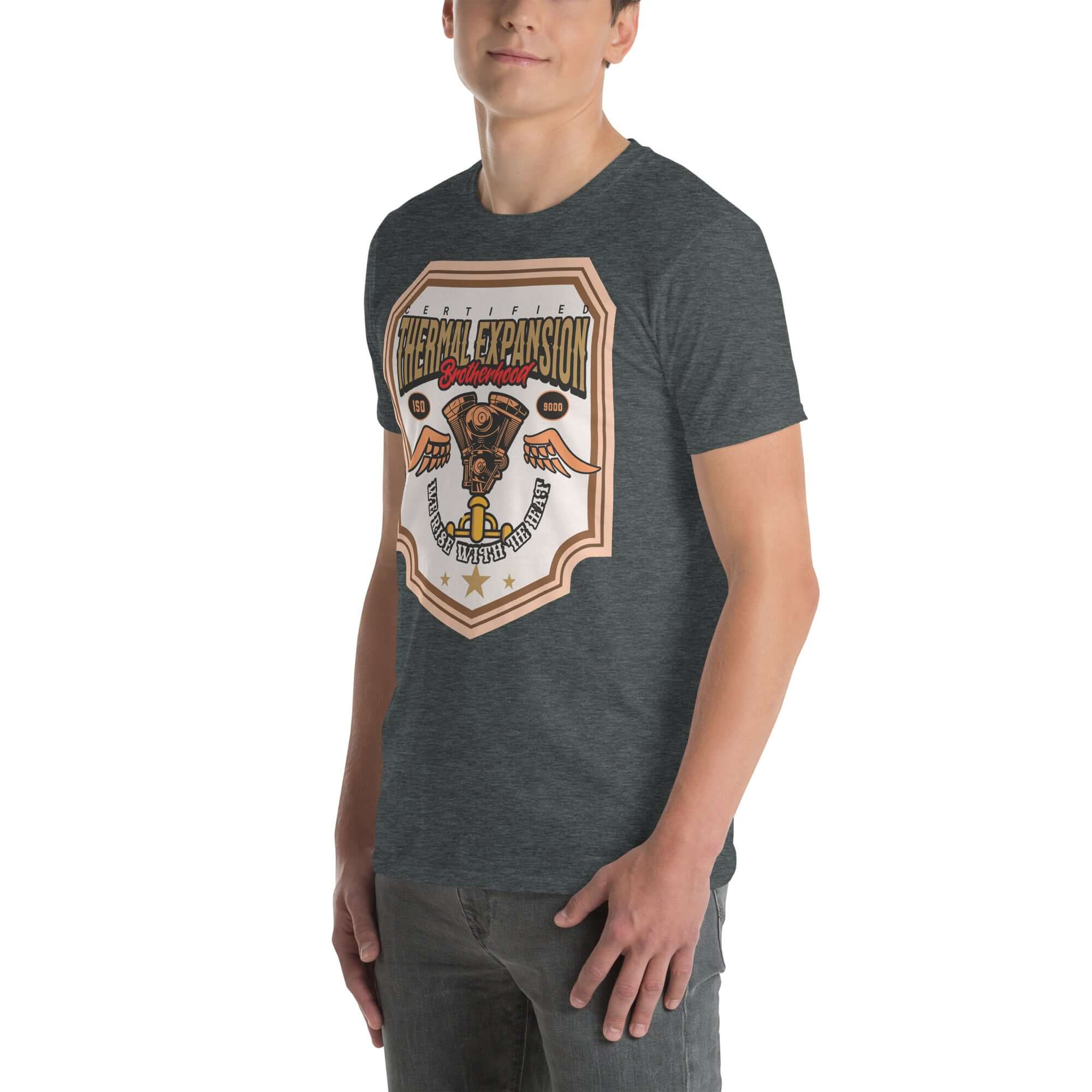 Man wearing Thermal Expansion Brotherhood T-shirt with V-twin engine and wings design, promoting scientific motorcycle apparel.