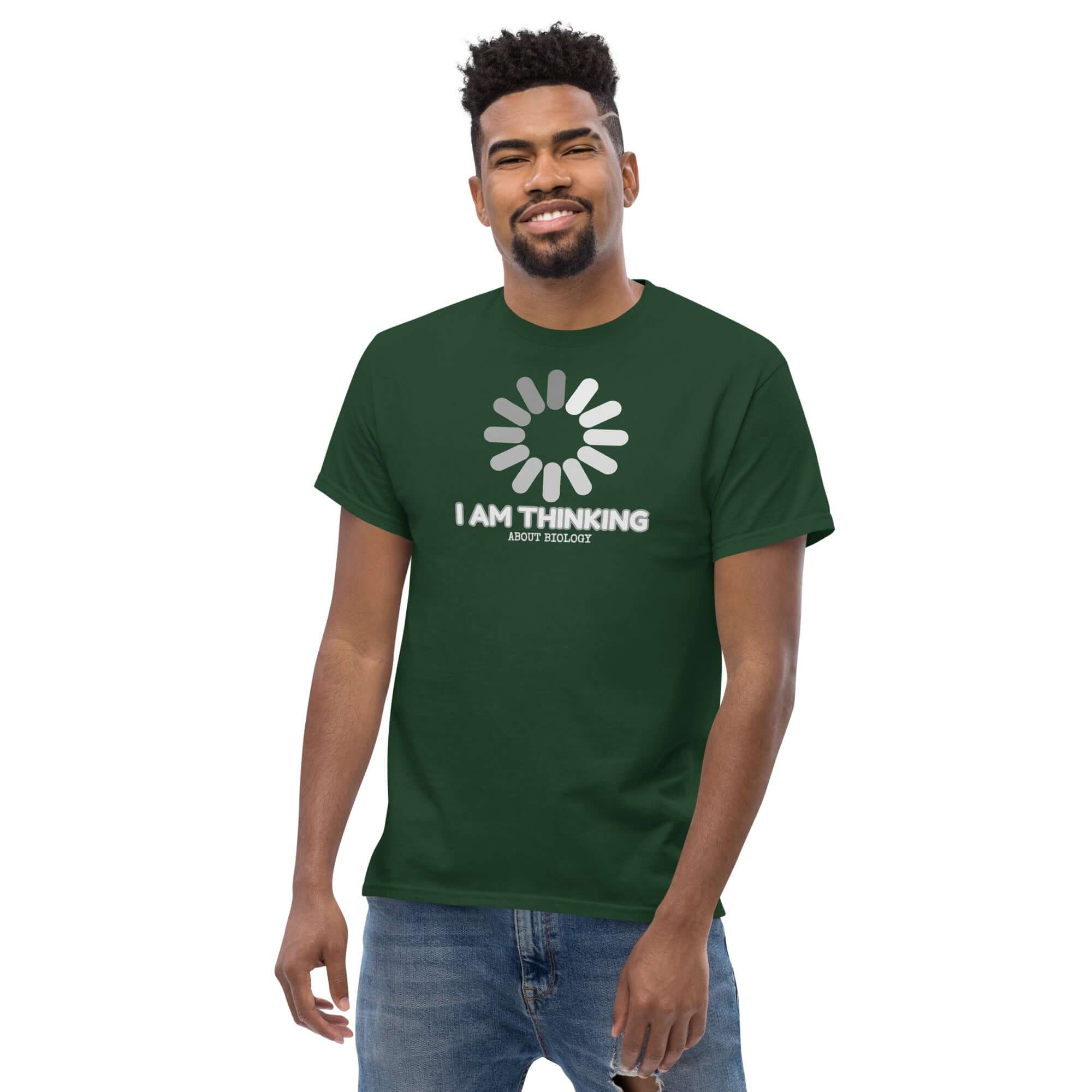 Man wearing 'I Am Thinking About Biology' t-shirt with loading symbol, green color, science humor, mental DNA theme.