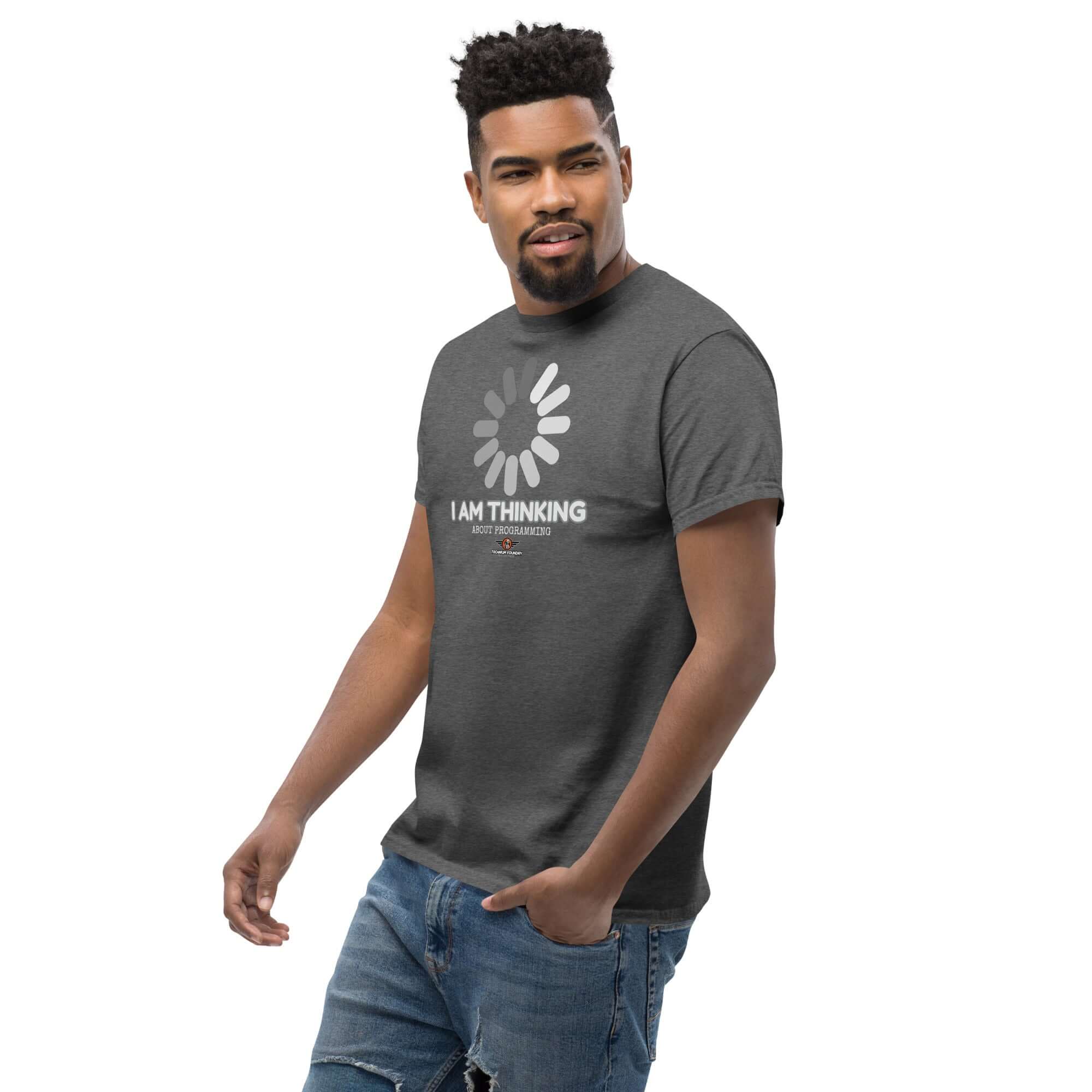 Man wearing 'I Am Thinking About Programming' T-Shirt featuring a loading screen design, perfect for coding enthusiasts and programmers.