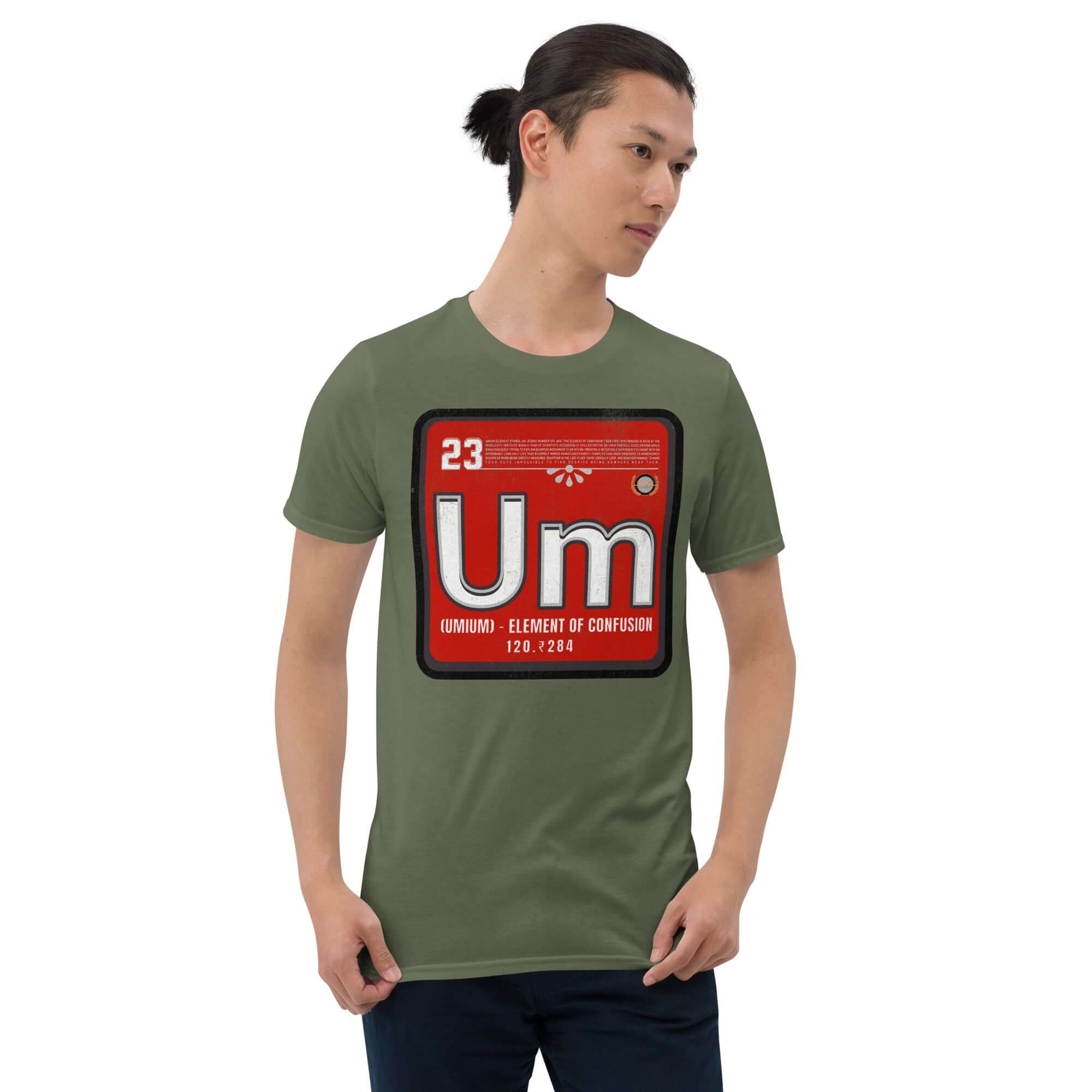 Man wearing Umium Element T-Shirt with periodic table design on green fabric.