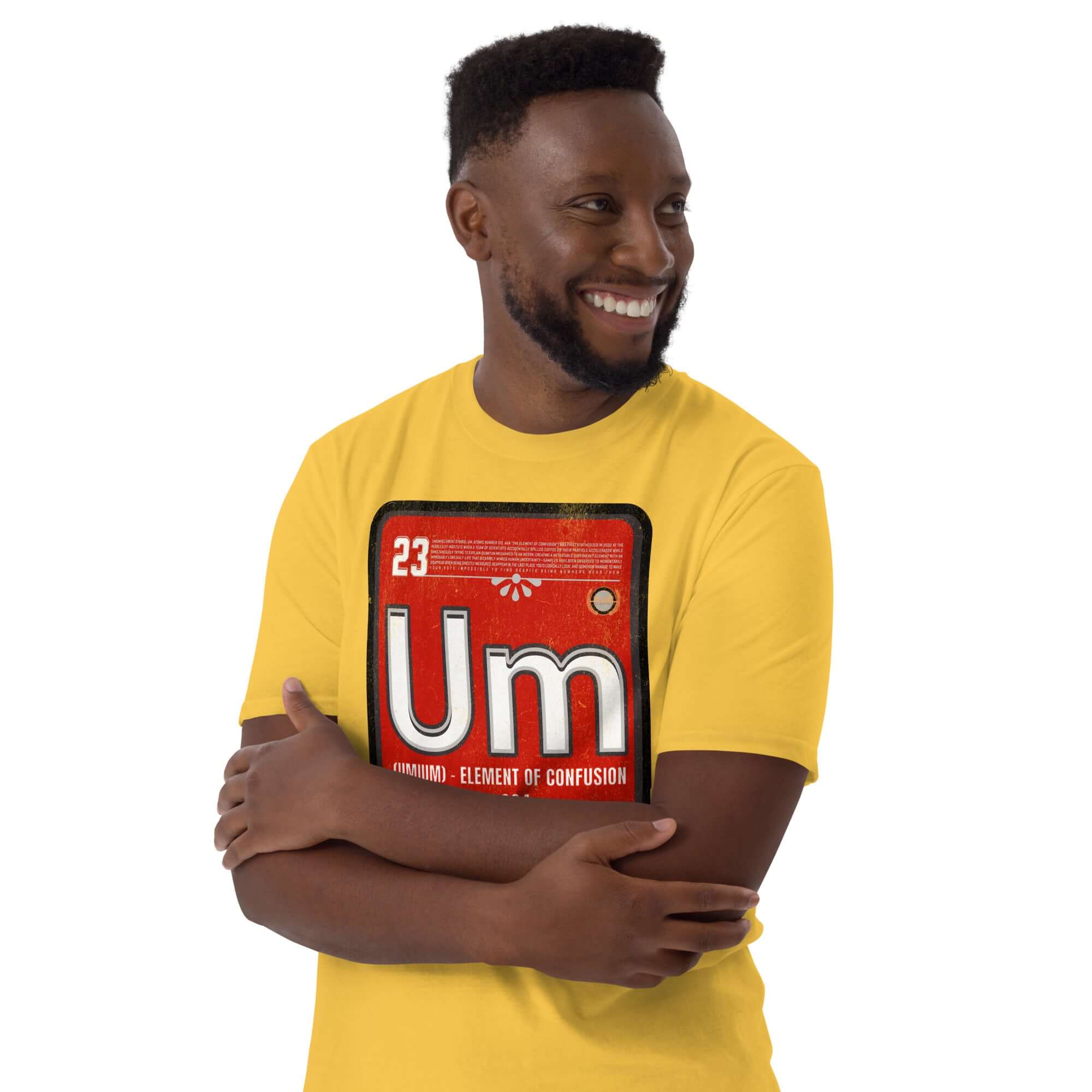 Man wearing a yellow t-shirt featuring the fictional "Umium" element on the periodic table, symbolizing confusion, with a red background.